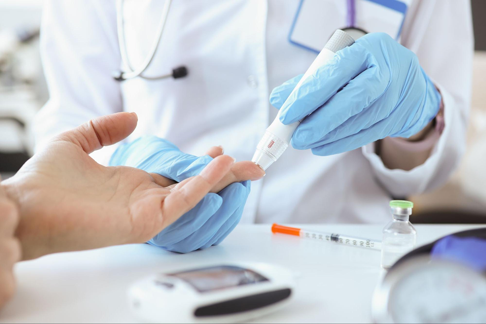 Doctor performs glucose test