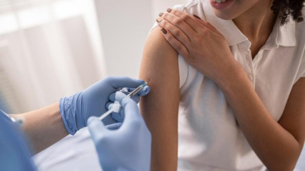 Person receiving a vaccination in their arm.