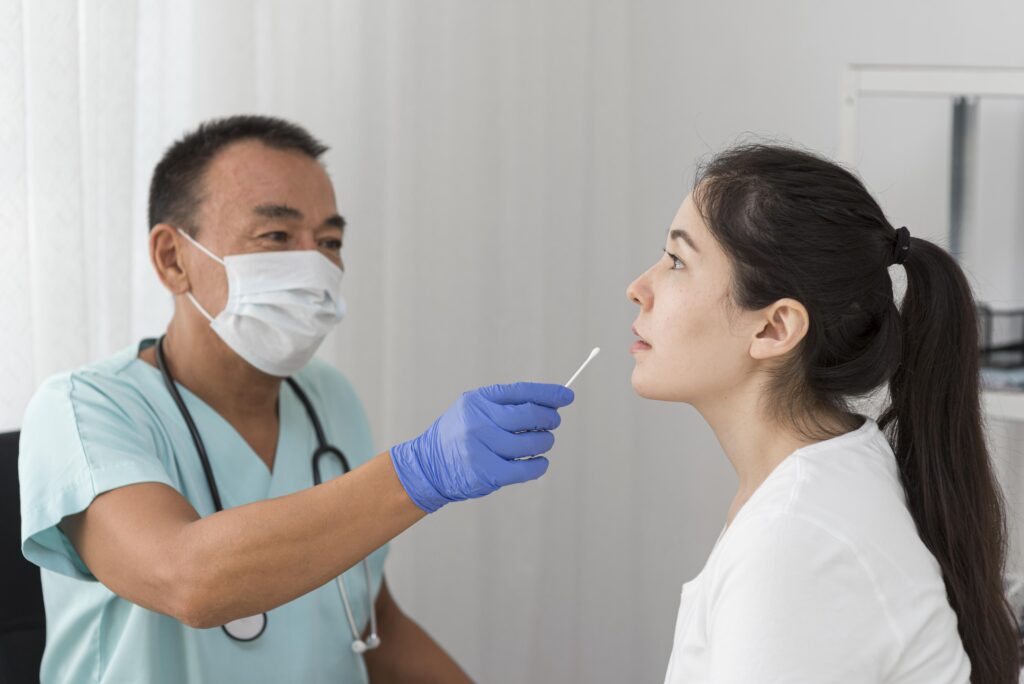 Doctor performing a nasal swab test.