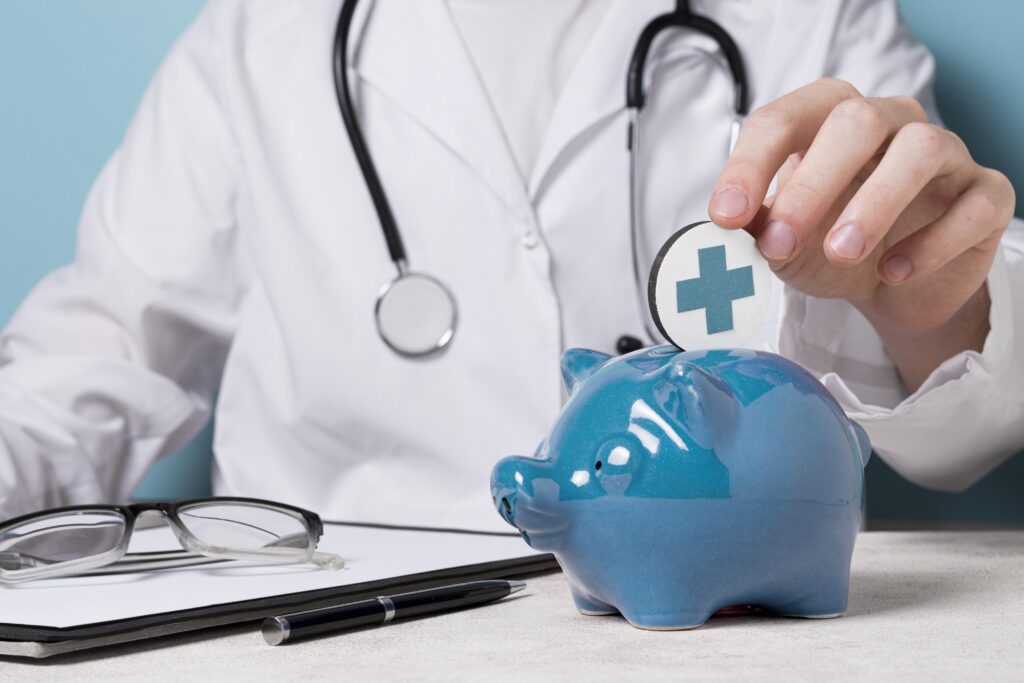 Doctor placing medical insurance coin in piggybank.