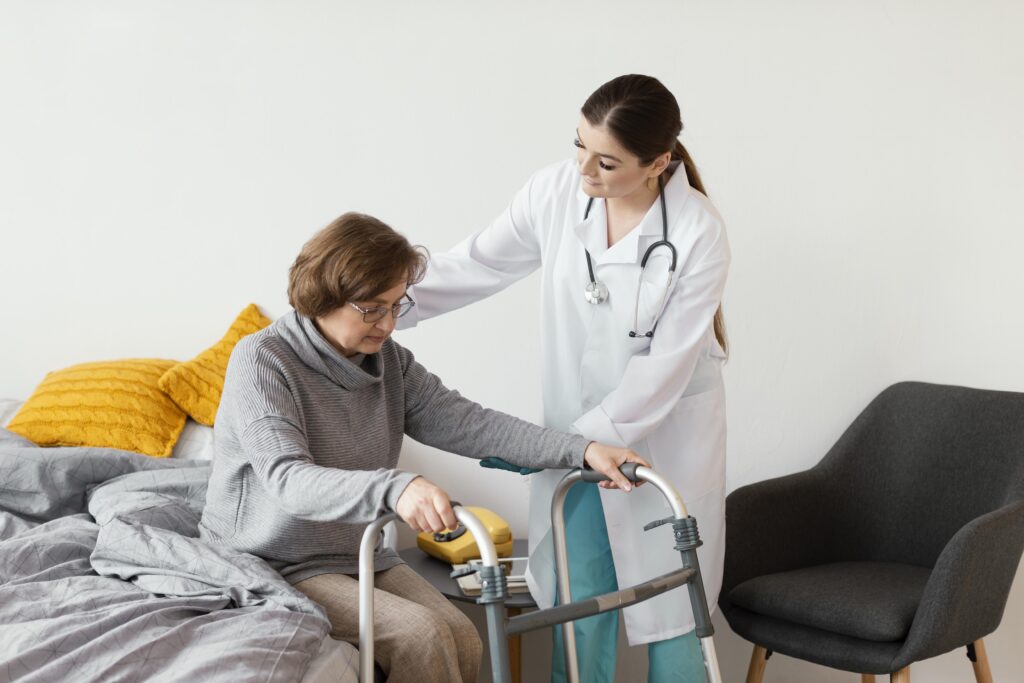A doctor assisting an elderly woman with walker.
