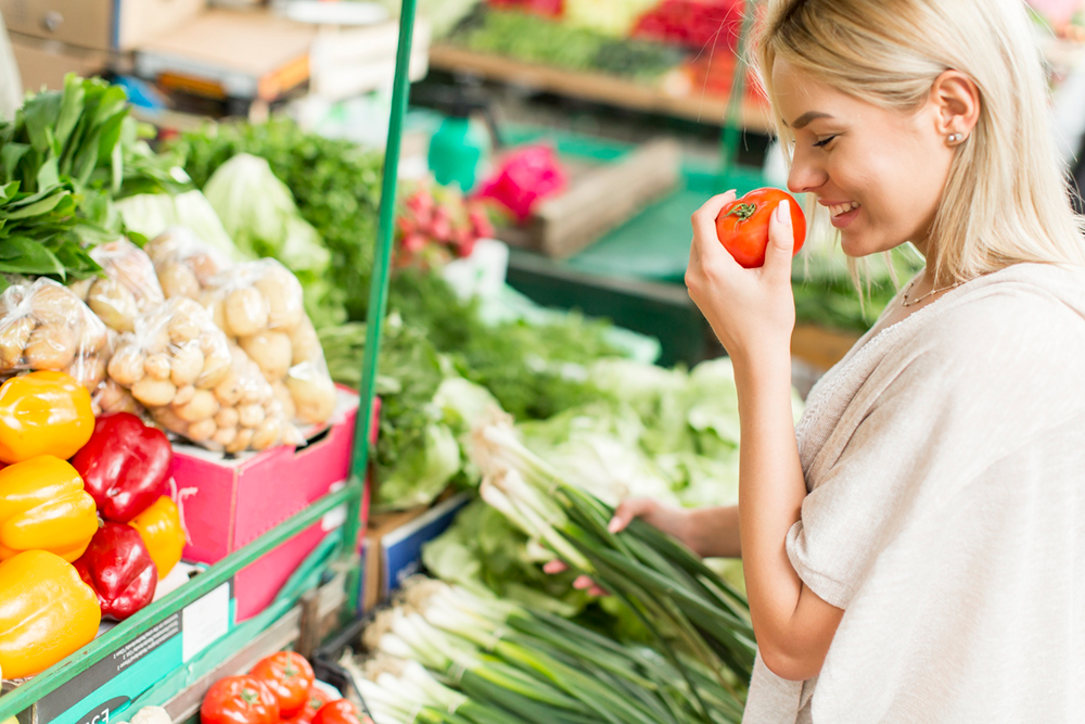 Woman picking fresh vegetables